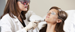 Beautician carrying out the procedure of laser skin
